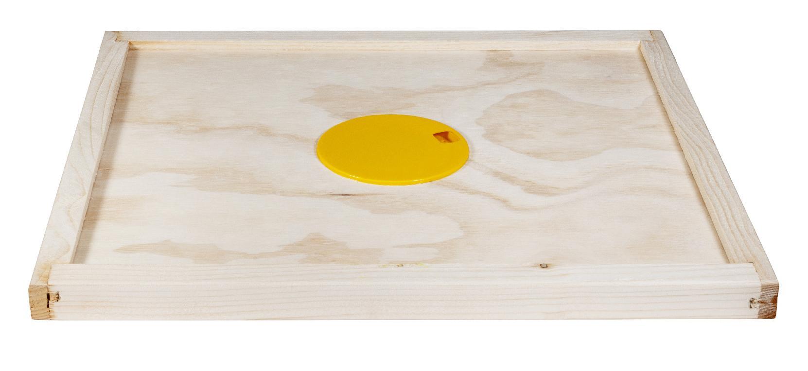 Tavoletta apiscampo in legno vista dall'alto su superficie bianca